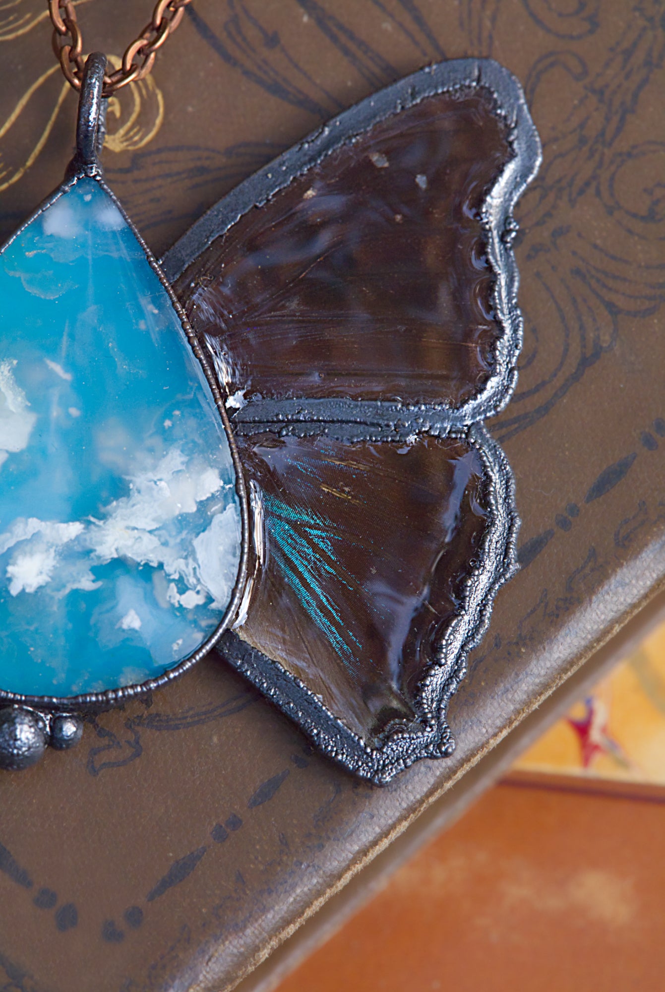 Plume agate and butterfly wing necklace