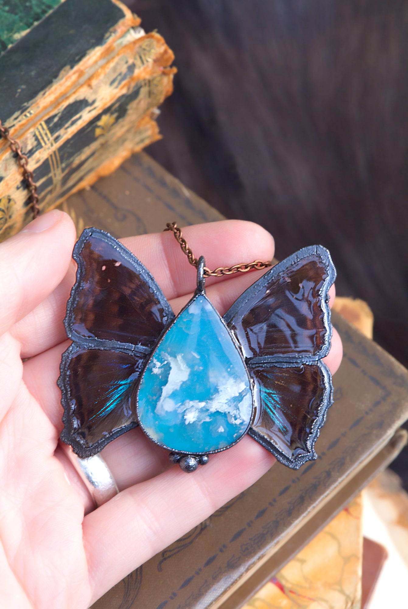 Plume agate and butterfly wing necklace
