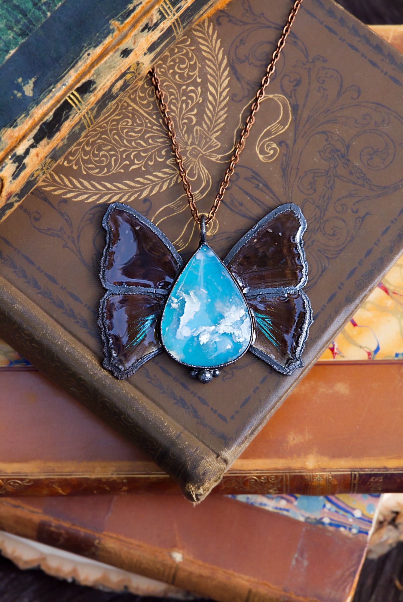 Plume agate and butterfly wing necklace
