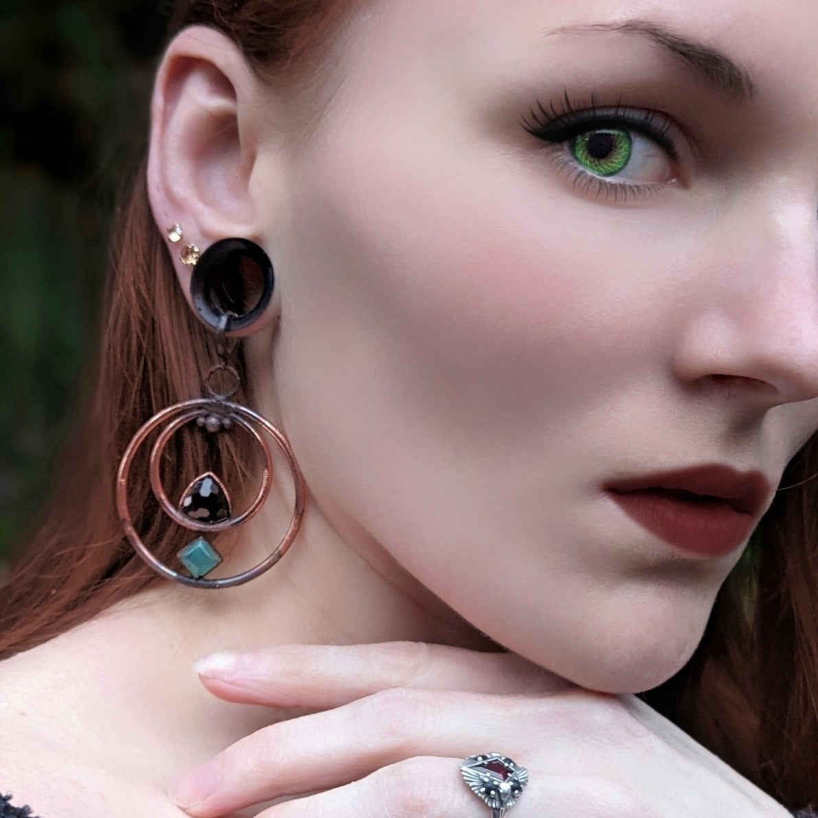 Black and green onyx in copper earrings